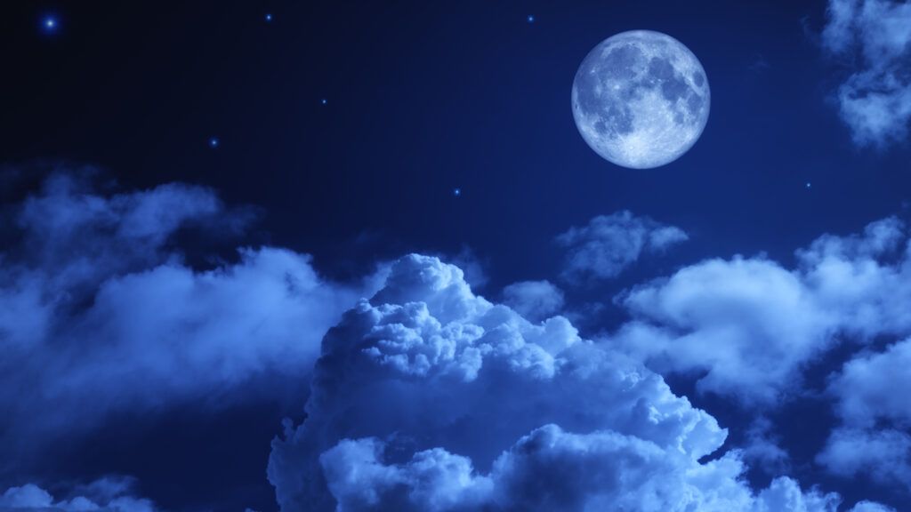 Puffy clouds on a moonlit night