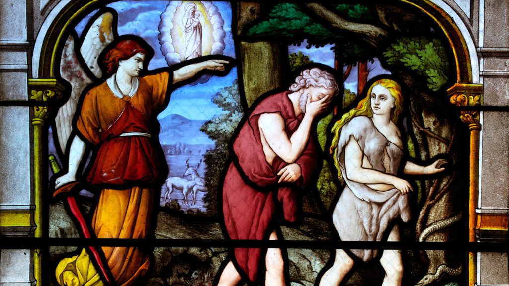 Adam and Eve being banished from the Garden of Eden, depicted in stained glass