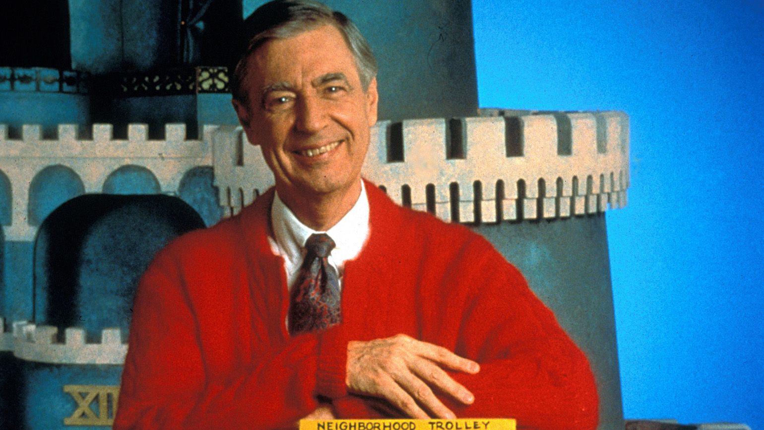 Fred Rogers in front of the castle used in his children's television series.