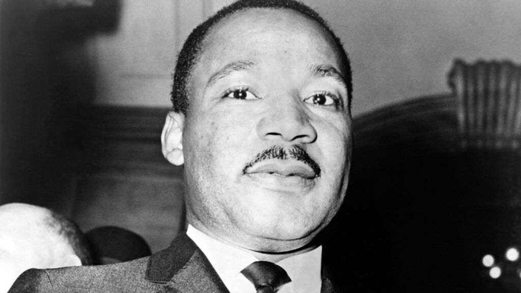 Dr. Martin Luther King, Jr. saying a prayer