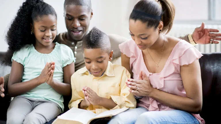 Family praying together for their Lenten journey