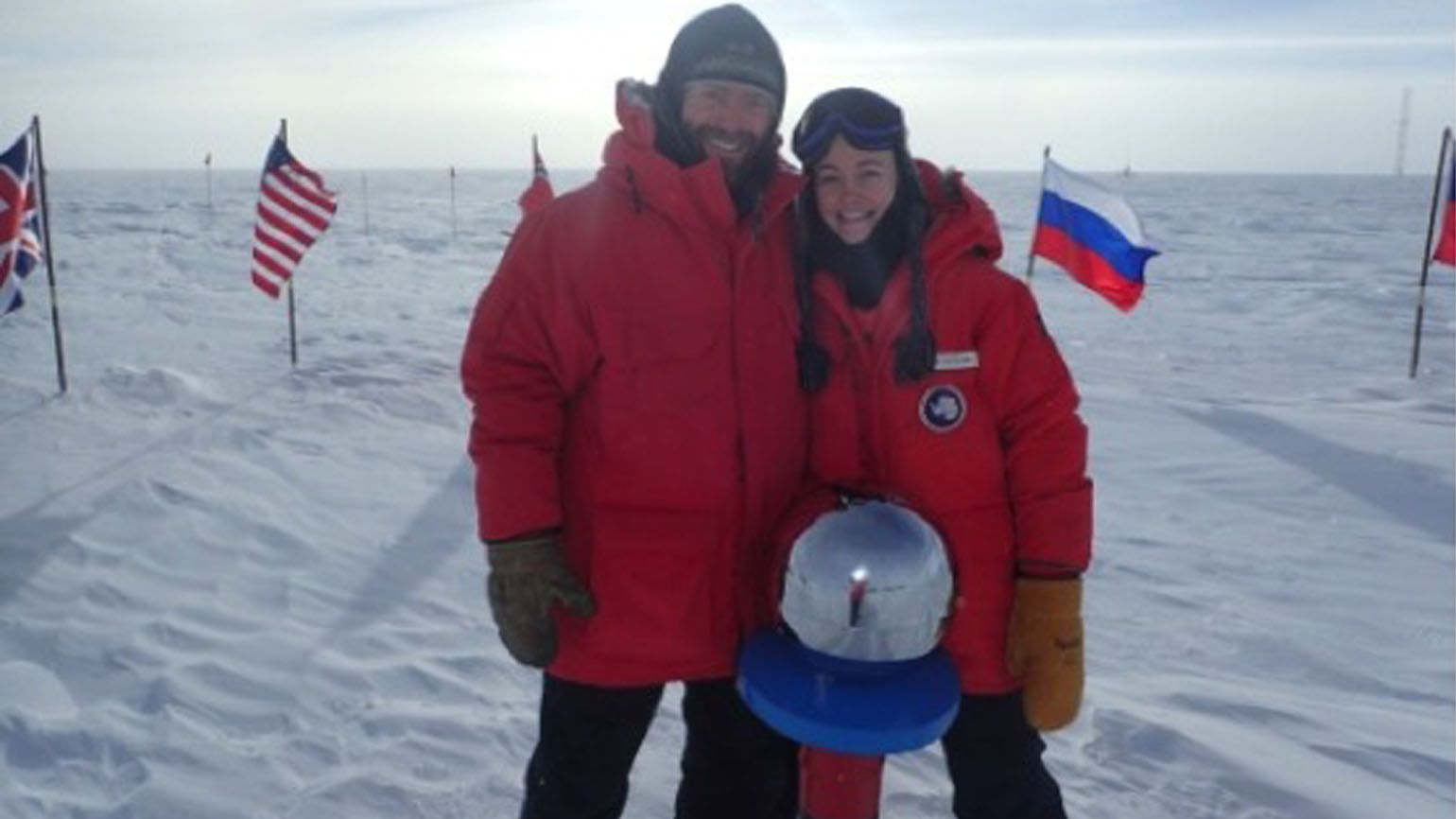 Sarah and Brett reaching the South Pole.