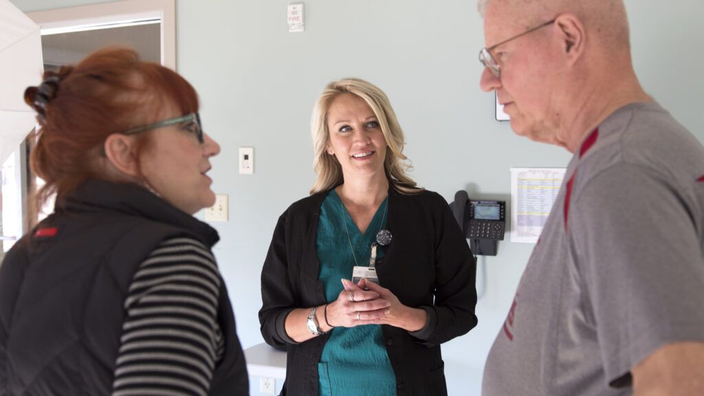 Everette in discussion with his wife Karla and a doctor.