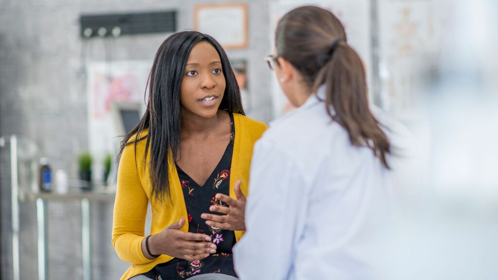 A woman consults with her doctor