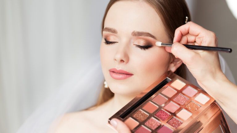 Close up of bride's face with Carmindy giving make-up tips