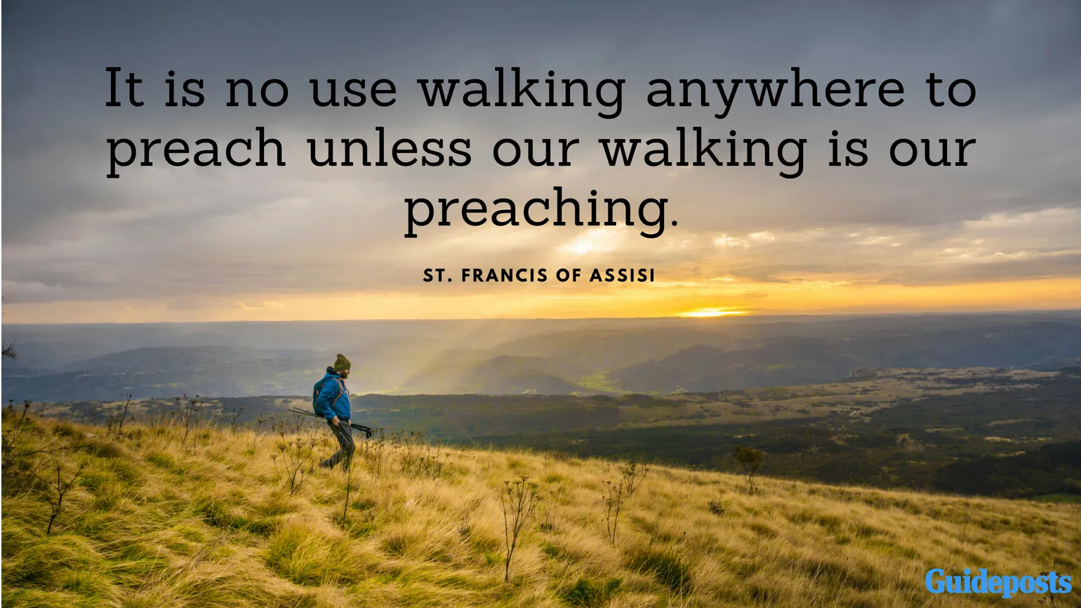 A person walking through a field with Saint Francis quotes