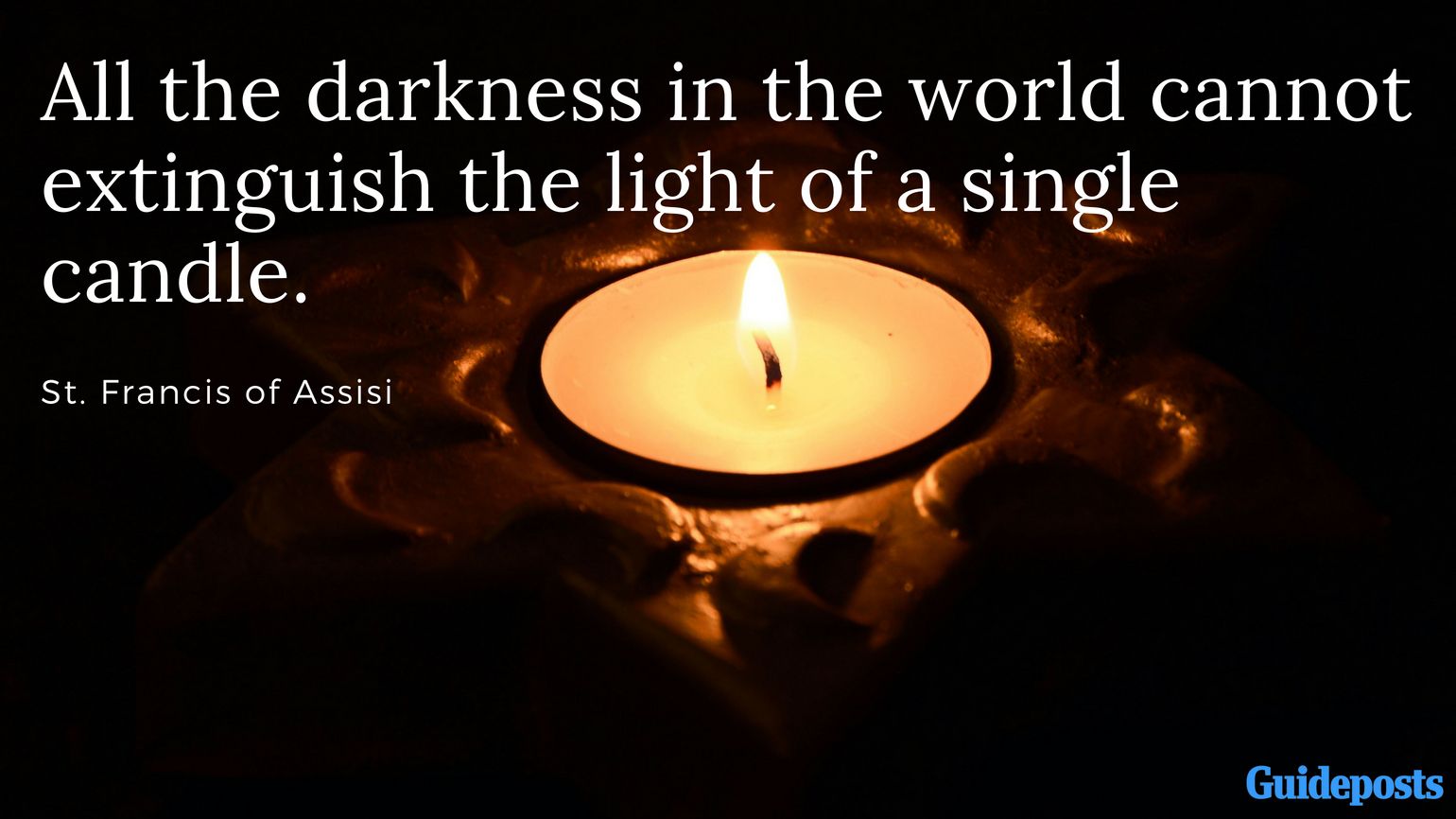 A lit candle in the dark and Saint Francis quotes