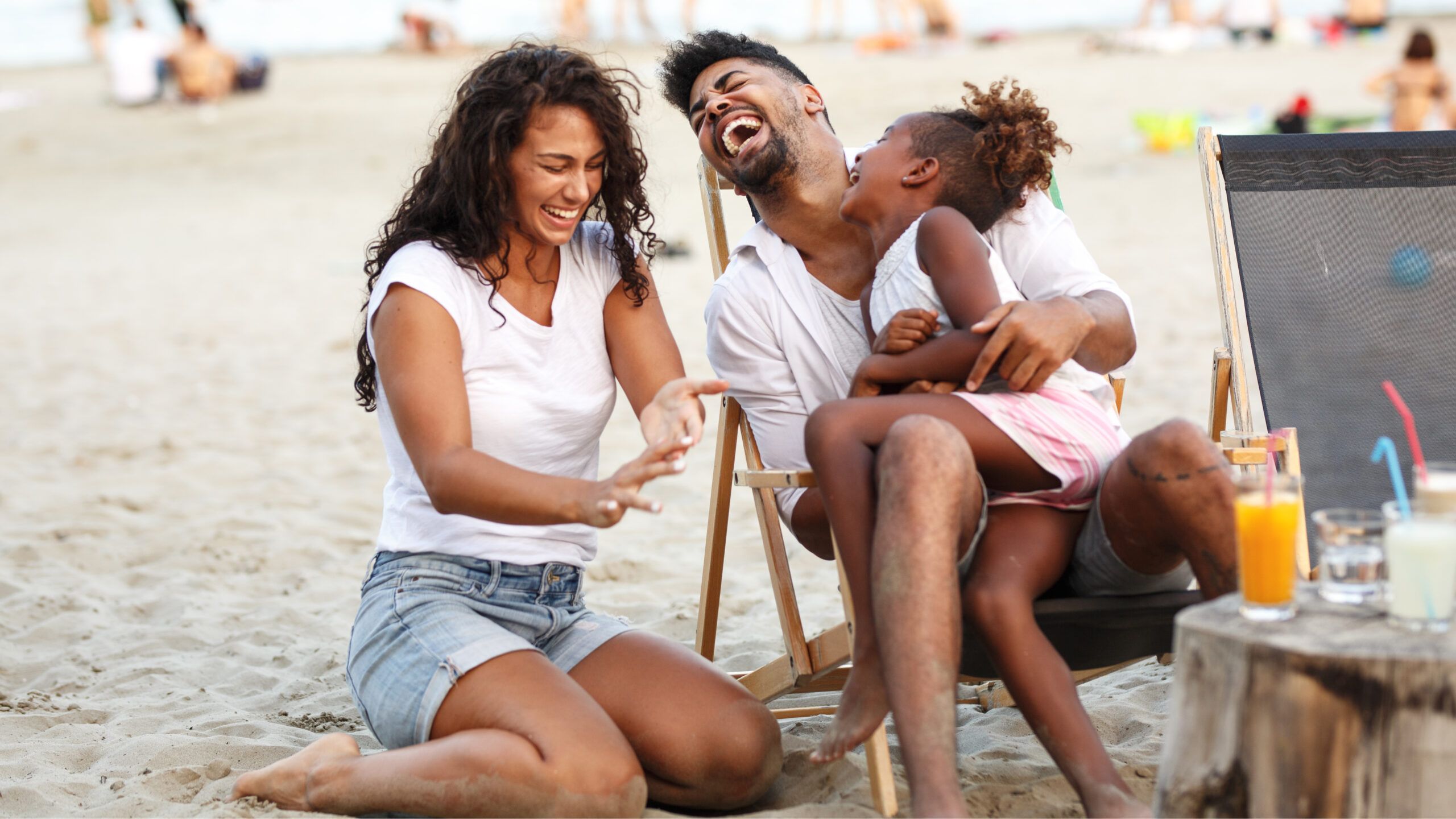 Family laughing on the beach