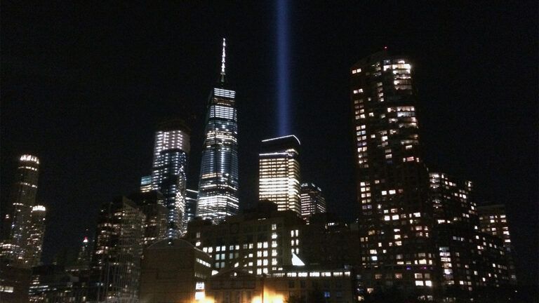Beams of light point skyward from the World Trade Center in NYC