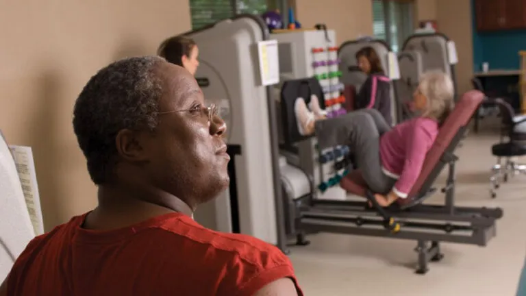 A senior man working out in the gym.