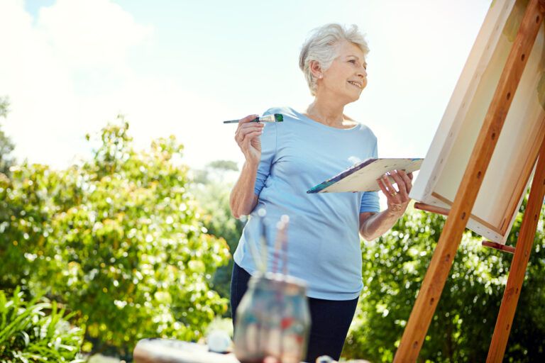 Woman painting outside