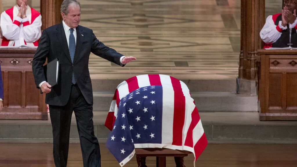 George W. Bush saying goodbye to his father, George H.W. Bush