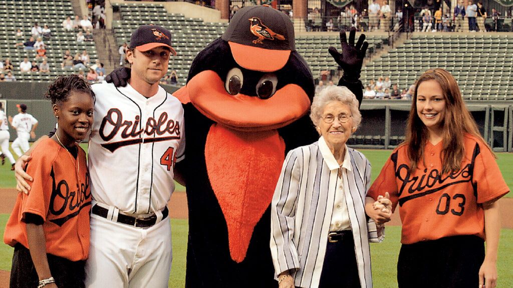Peggy Rowe's mom with the Orioles' ball girls, mascot and pitcher Kerry Ligtenberg