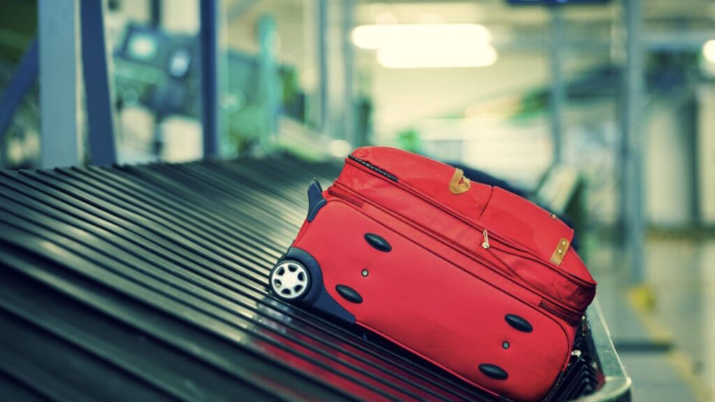 Heaven-sent comfort on Christmas: red luggage at baggage claim