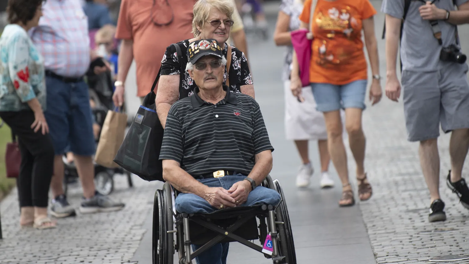 Connie accompanies Eddie during his visit to the Vietnam Veterans Memorial