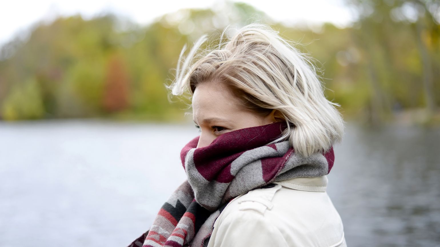 Health myths about Winter: Cold Air Makes You Sick. Woman bundled up with scarf outside. better living health wellness