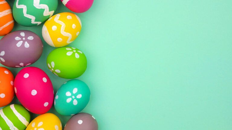 Colorful easter eggs on a blue background are a favorite thing about spring