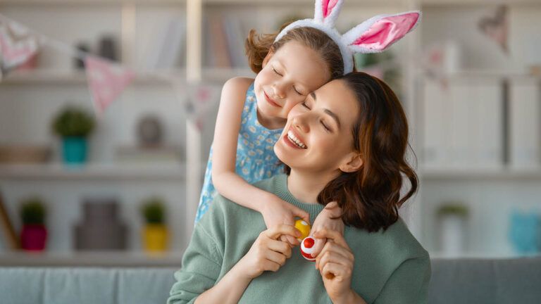 Mother and daughter hug to celebrate easter with quotes