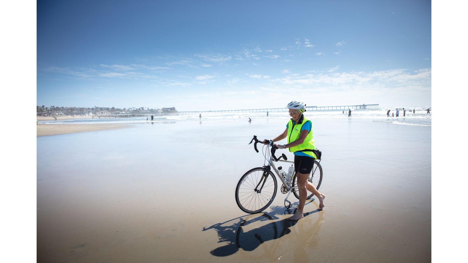Carol Garsee, Cancer survivor, at Dog Beach, San Diego – All finished her cross country bike ride to the Pacific Ocean.  better living health wellness living longer living better