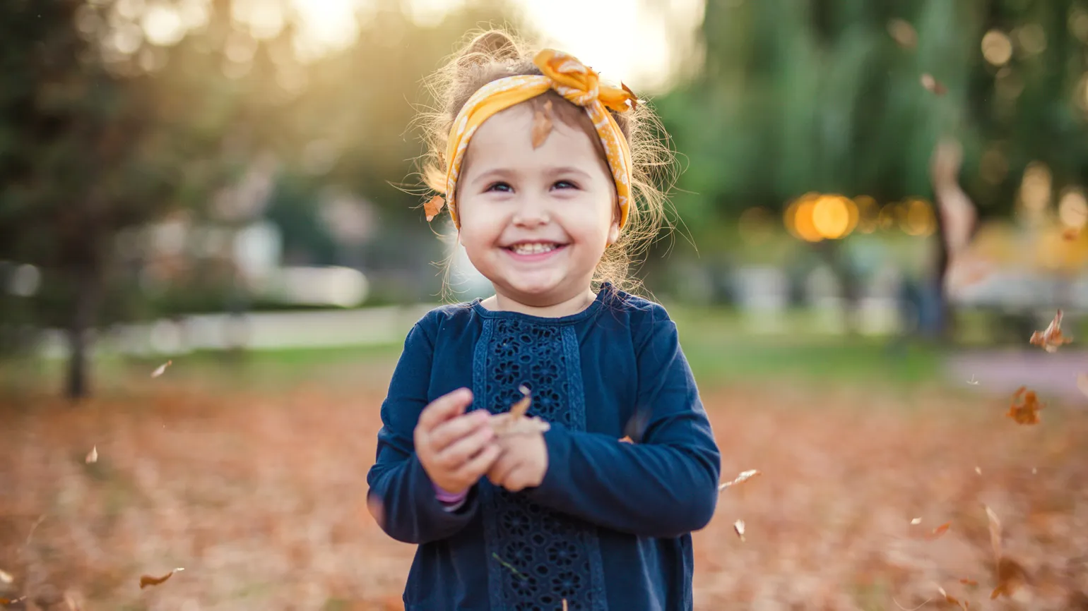 A young girl smiling during the Autumn season. Looking at my kids: Mysterious Ways Editors Share what makes them feel awe inspiration miracles gods grace