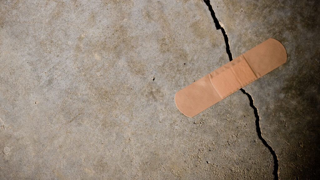 A band aid on a crack in concrete.