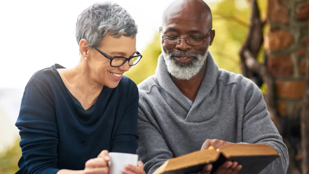 Man and woman ready Bible