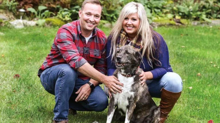 The Chiassons and their dog, Bear