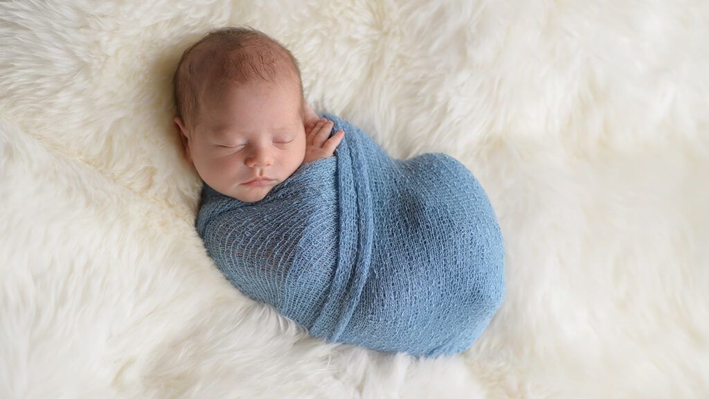 A infant, bundled up