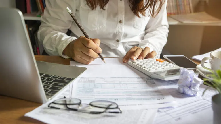 A woman doing her taxes.