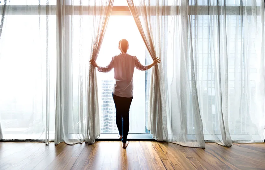 Woman facing the sunlight