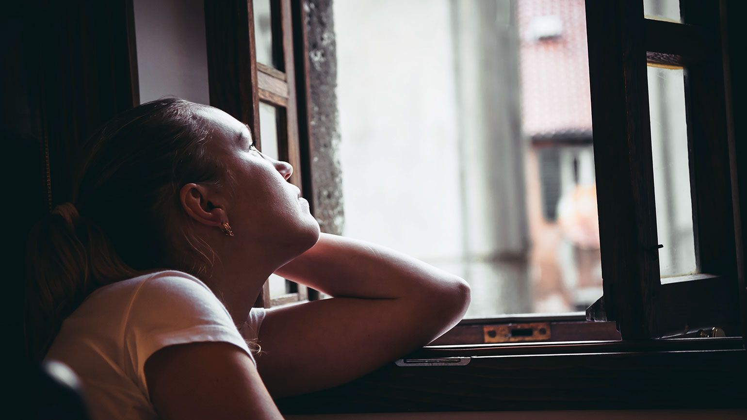 Woman looking out a window