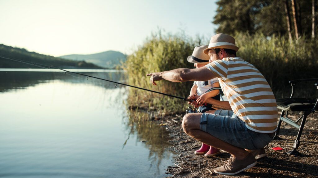 A father and son go fishing.