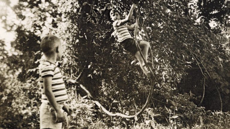 The lifesaving photo of Doug climbing a muscadine vine as Buddy Earl looks on