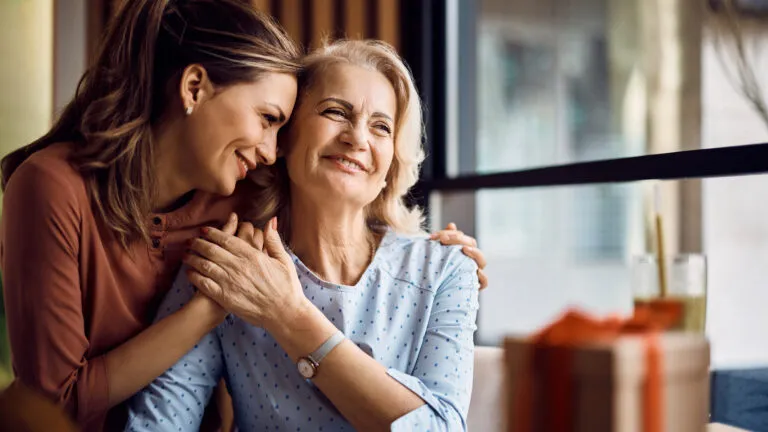 Mother and daughter hugging to spiritually change their lives in 2023