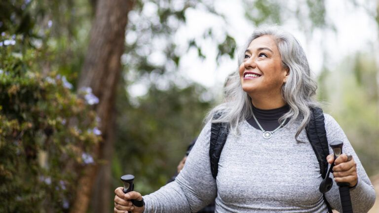Woman hiking in the woods to change her life in spiritually 2023