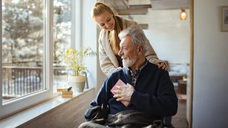 A daughter caregiving for her father.