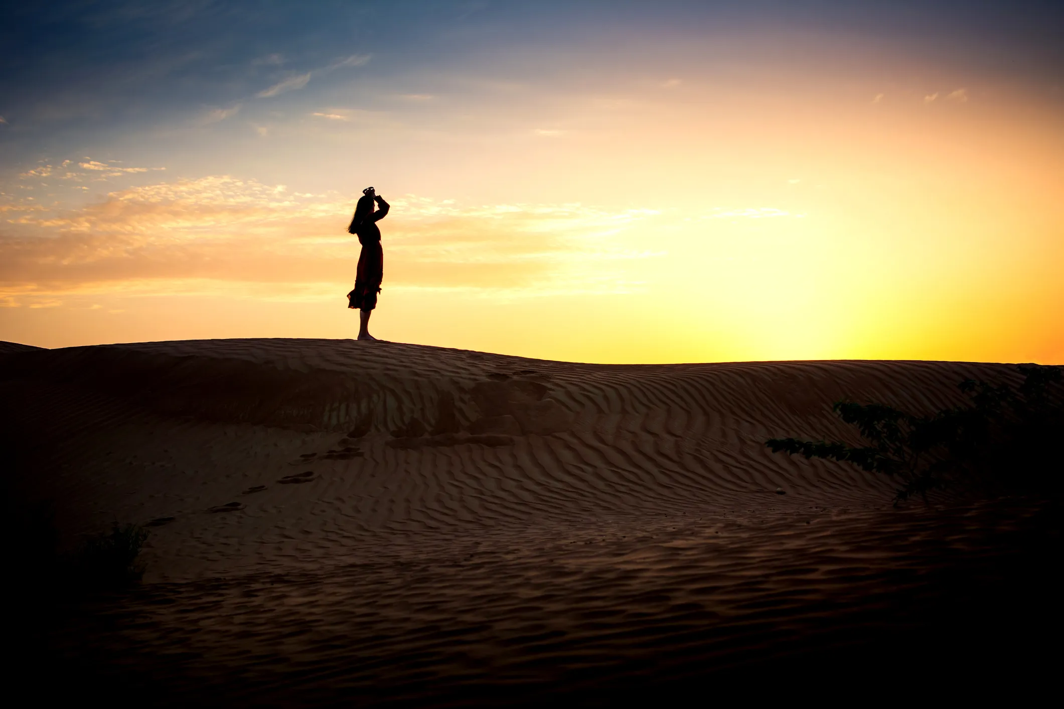 A female figure silouette in light.