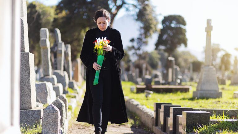 Grieving woman at a cemetery