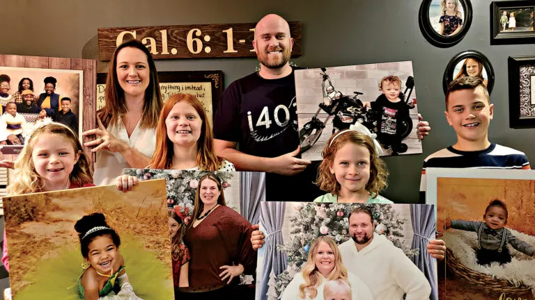 The Bononi family with some of the portraits they rescued; photo courtesy Brian Bononi