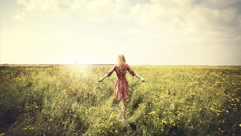 Woman walking in a field