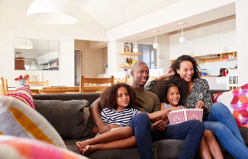 Family watching a movie together