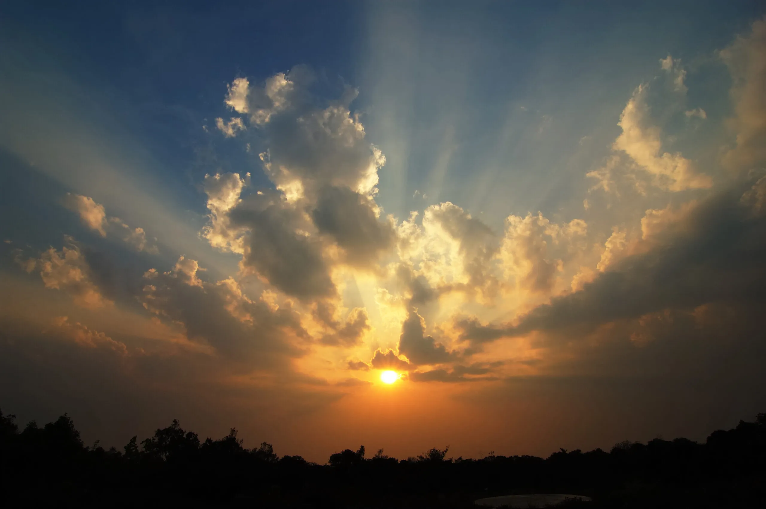 The sun breaking through clouds; Getty Images