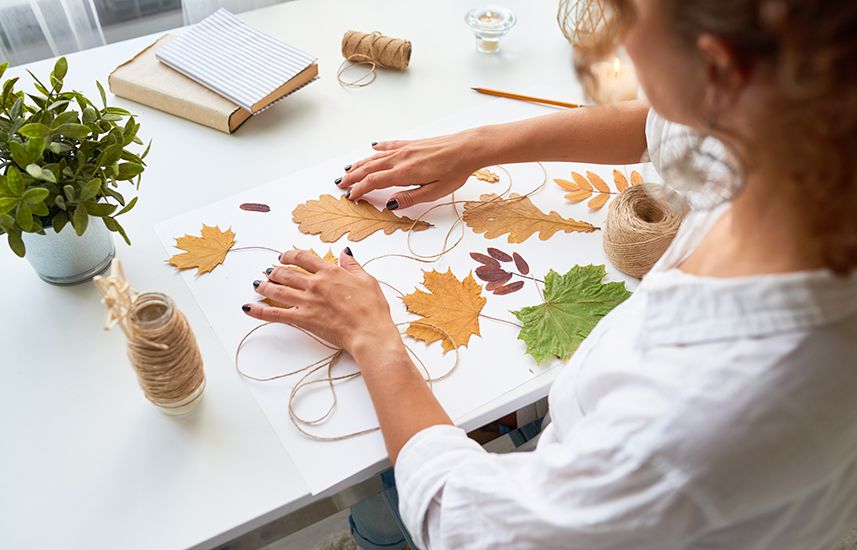 Woman making leaf art