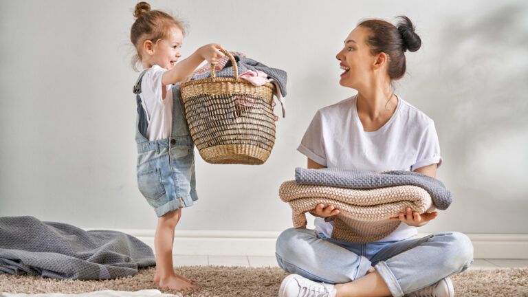 Mother and daughter decluttering; Getty Images