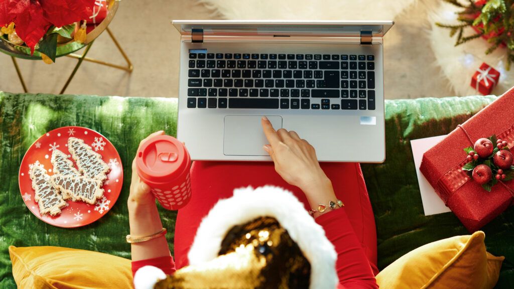 Woman celebrating holidays virtually; Getty Images