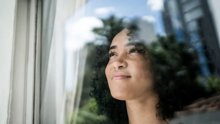 Woman looking our window at how to do lent in a new way this year