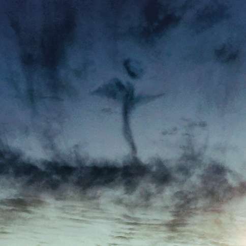 Guideposts: An angel appears in the clouds at twilight over Northport, Alabama