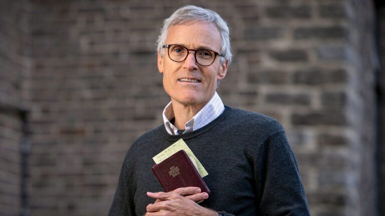 Rick Hamlin with his father's Bible; photo by Jim Anness