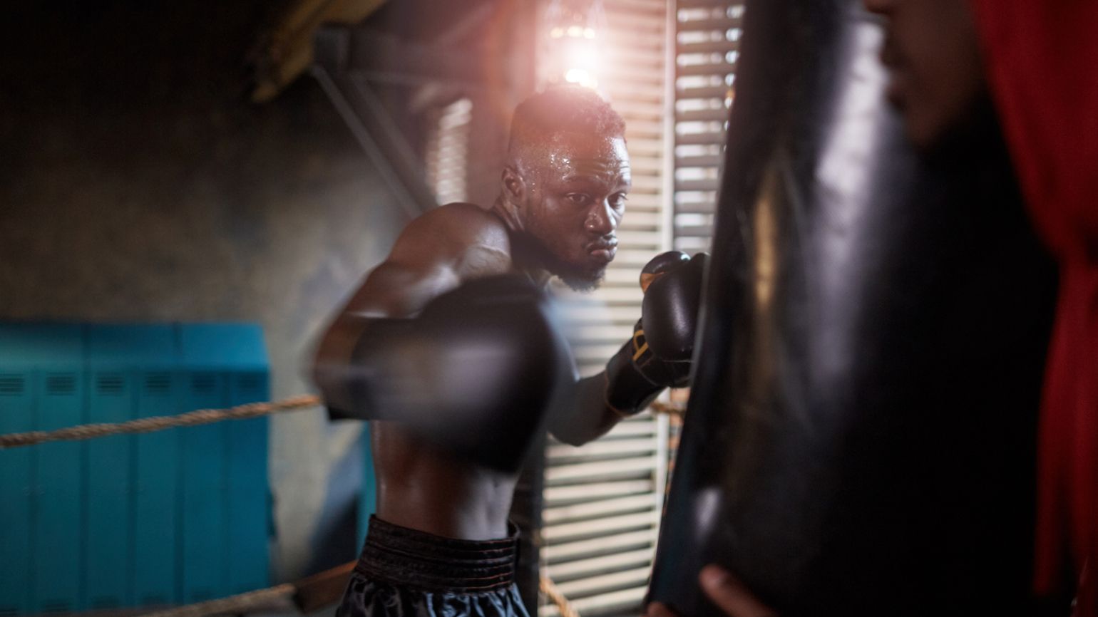 Man boxing in a gym; Getty Images