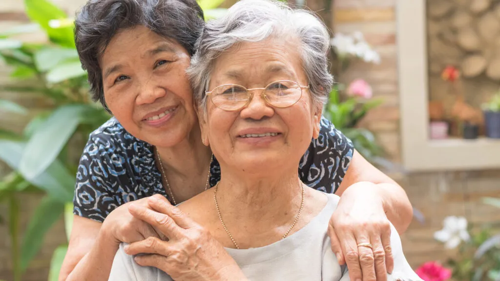 A family caregiver and her client; Getty Images